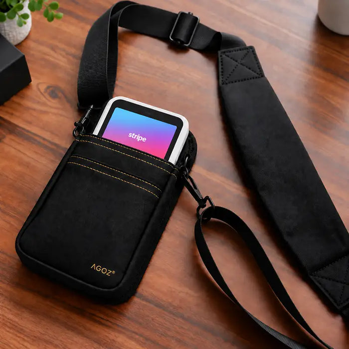 Black Agoz crossbody holster with Stripe Reader S700/S710 and padded shoulder strap on a tabletop
