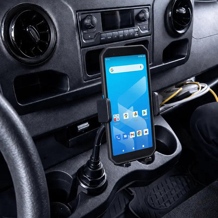 Almex handheld computer mounted in a cup holder cradle inside a commercial vehicle