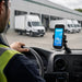 Almex handheld computer in a dashboard cradle mount used in a commercial fleet vehicle