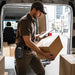 Point Mobile waist belt case worn by delivery worker during mobile logistics and package handling workflow
