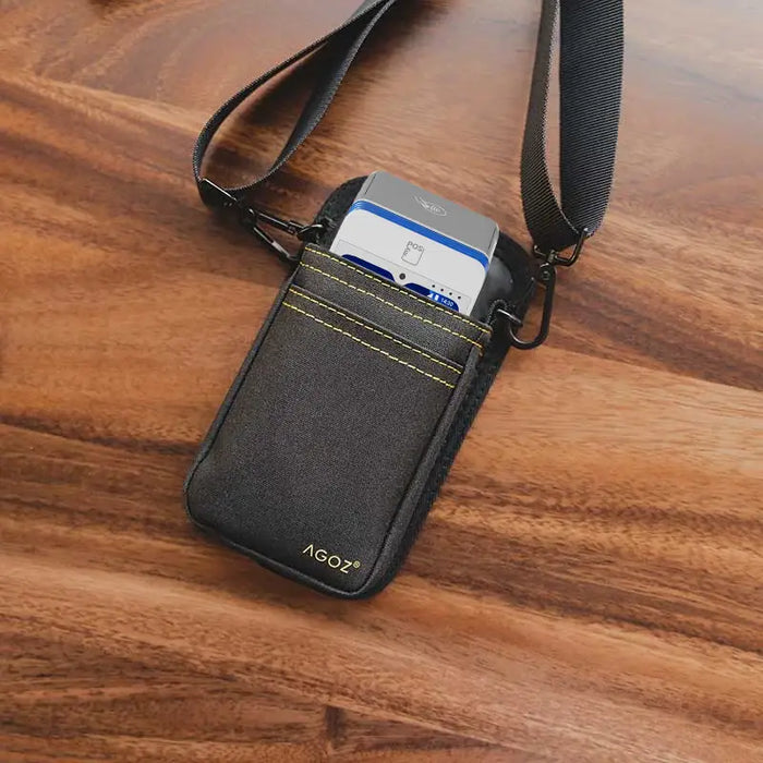 Black myPOS Mobile Terminal Holster with shoulder strap on wood tabletop