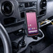 Keyence scanner secured in a cup holder vehicle cradle mount inside a commercial vehicle console.
