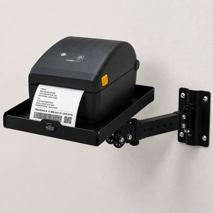 Black stainless steel Agoz wall-mounted shelf with swing arm supporting a desktop direct thermal label printer.