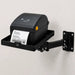 Black stainless steel Agoz wall-mounted shelf with swing arm supporting a desktop direct thermal label printer.