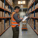Warehouse associate using a Urovo mobile computer with a belt-mounted Agoz case during shared inventory workflows.