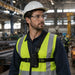 Warehouse worker wearing chest harness pouch for Midland two-way radio 
