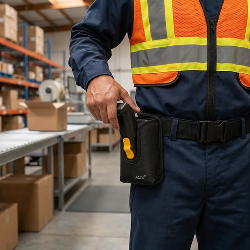 Close-up of AgozTech belt clip holster holding a Zebra trigger handle scanner on a warehouse worker’s waist belt.