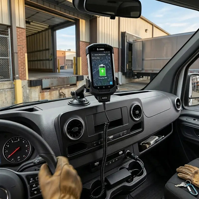 Zebra TC77 mobile computer charging in vehicle cradle on dashboard inside work van